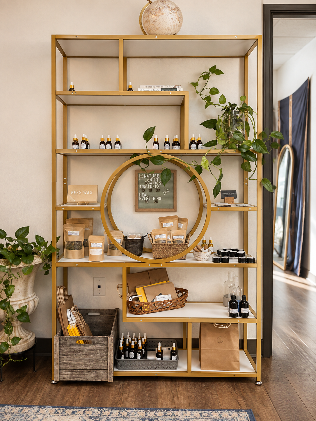 Apothecary shelf with tinctures, herbal blends, and beeswax goods